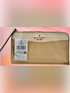 Kate Spade Two-Tone Cream & Beige Pebbled Leather Wristlet
MSRP-$139.00